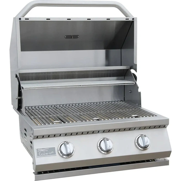 A built-in 26 inch 3 burner gas grill made of stainless steel, featuring control knobs on the front and a closed lid.